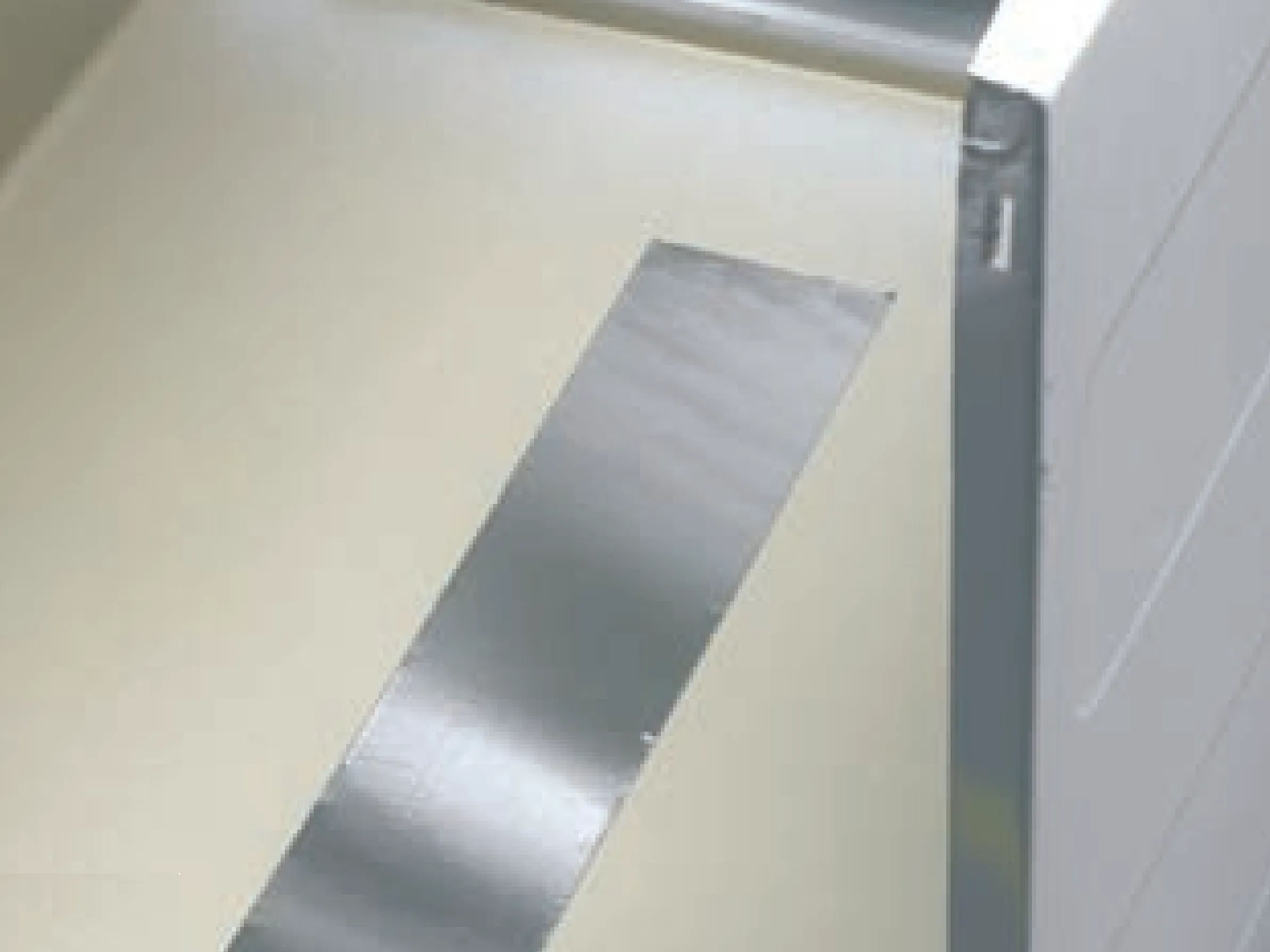 Die-Cut Strip of 3M Damping Foil 2552 On The Inside Of A Washing Machine