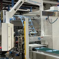 A rotary die cutting machine producing face masks.